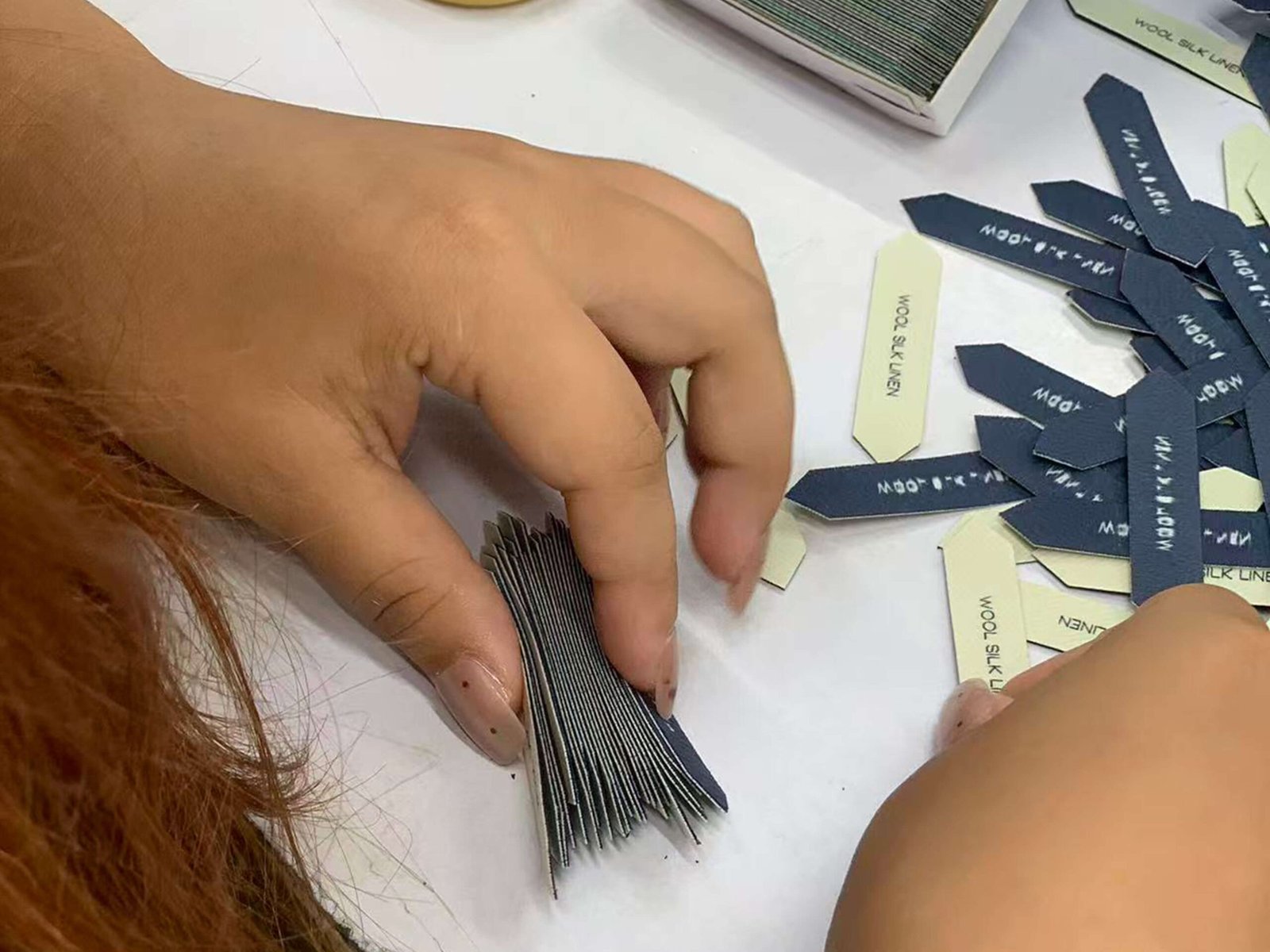 Hand checking woven label details